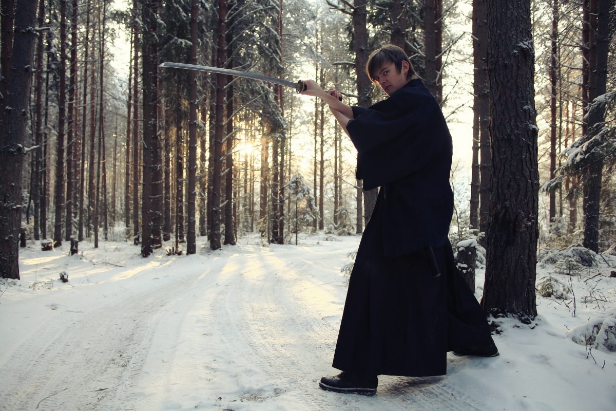 Man training weapons in snow forest - learn kung fu online