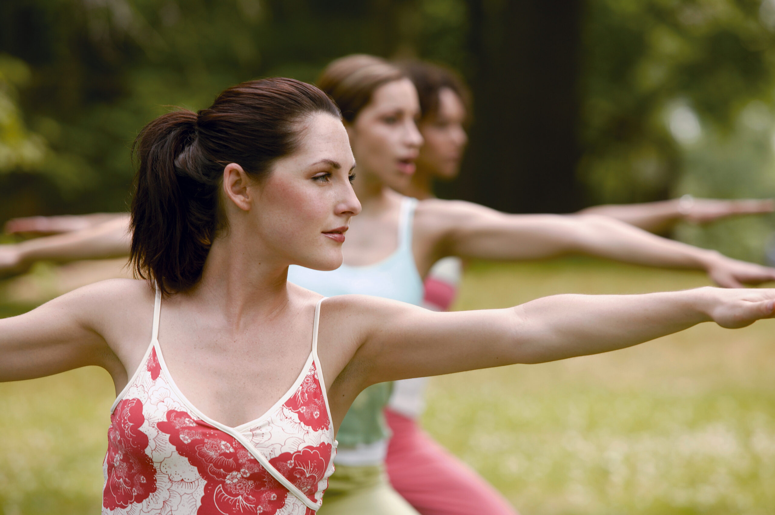 women doing warrior pose while yoga training - learn kung fu online