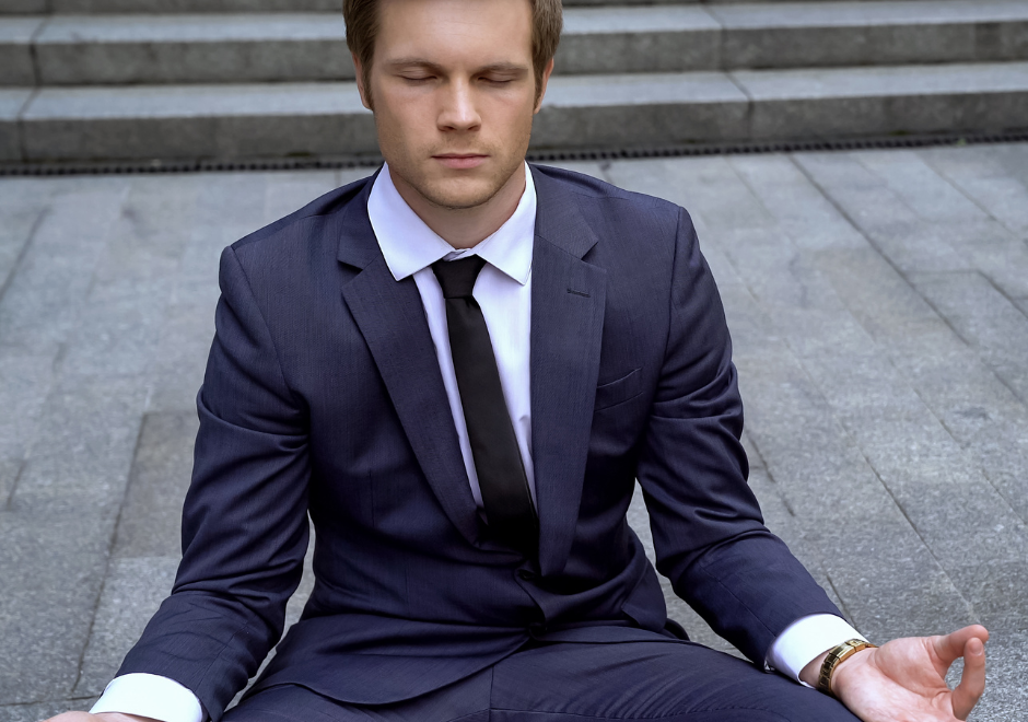 Man in suit meditating