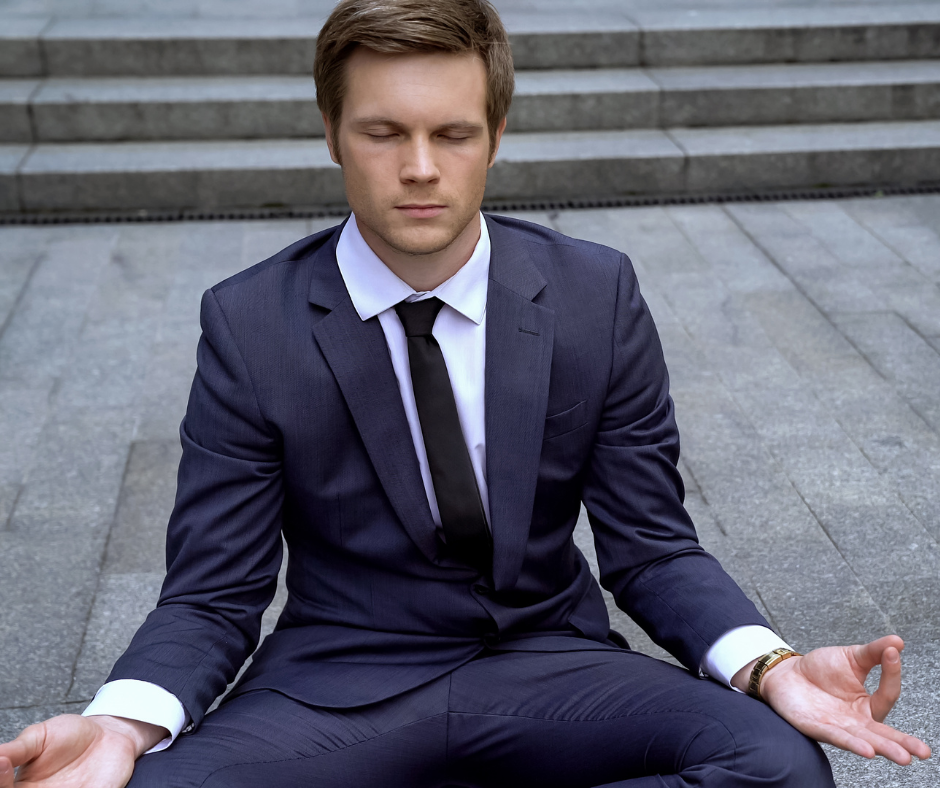 Man in suit meditating