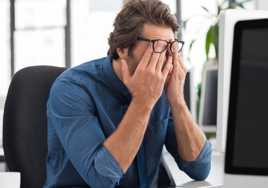 man at desk stressed