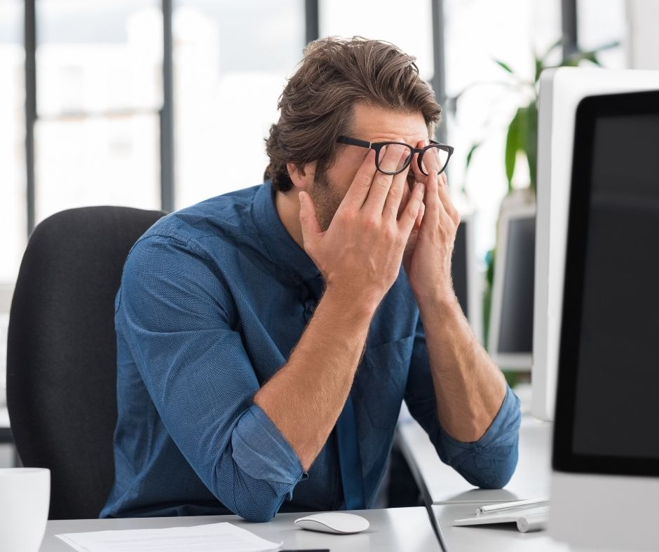 man at desk stressed